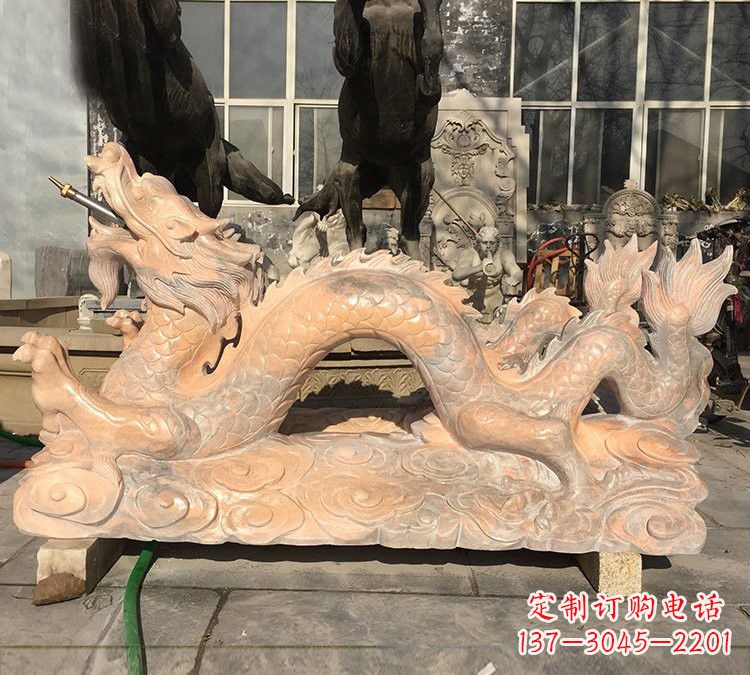 济南晚霞红石雕喷水龙